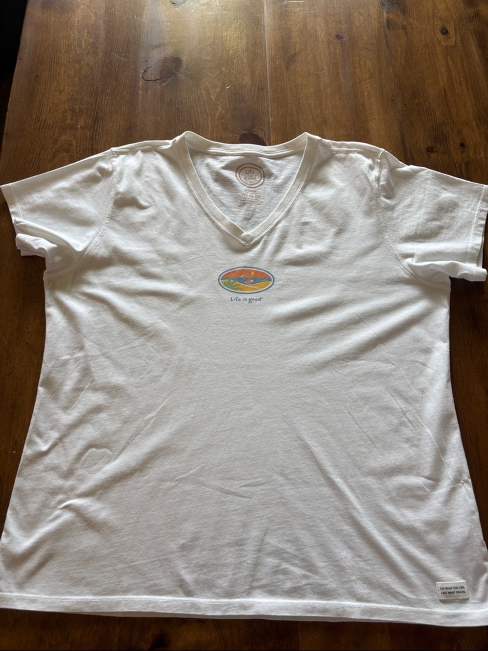 Life Is Good White V-Neck Tee with Small Sunset Oval Graphic